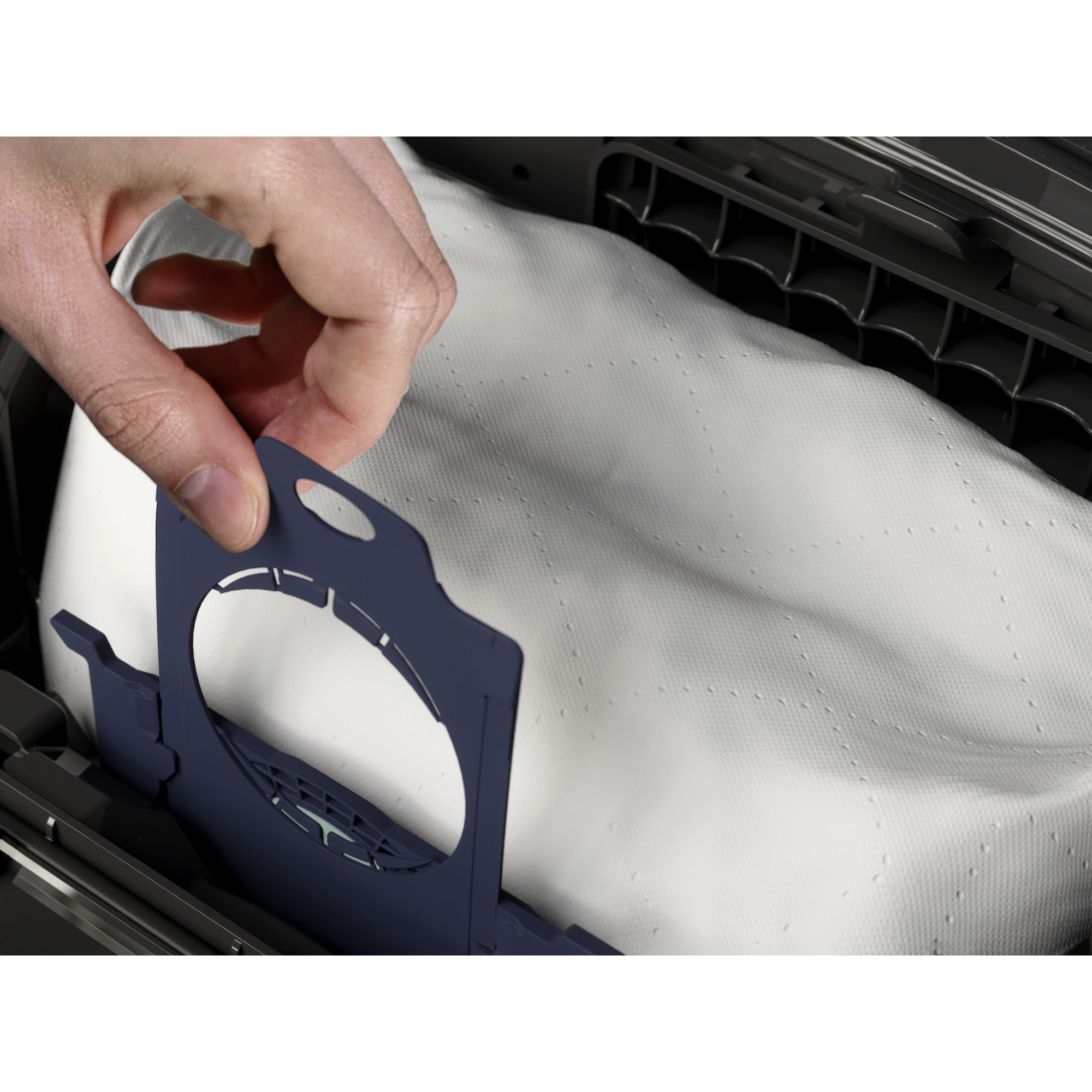 Showing the easy bag exchange. hand changing the s-bag in vacuum cleaner.