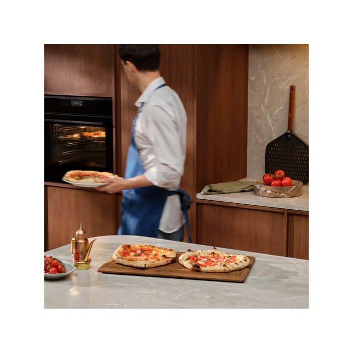 Person with the pizza expert oven and Neapolitan pizzas 